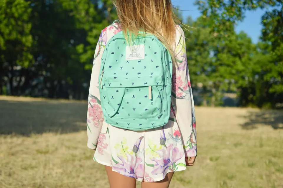 Woman with green backpack