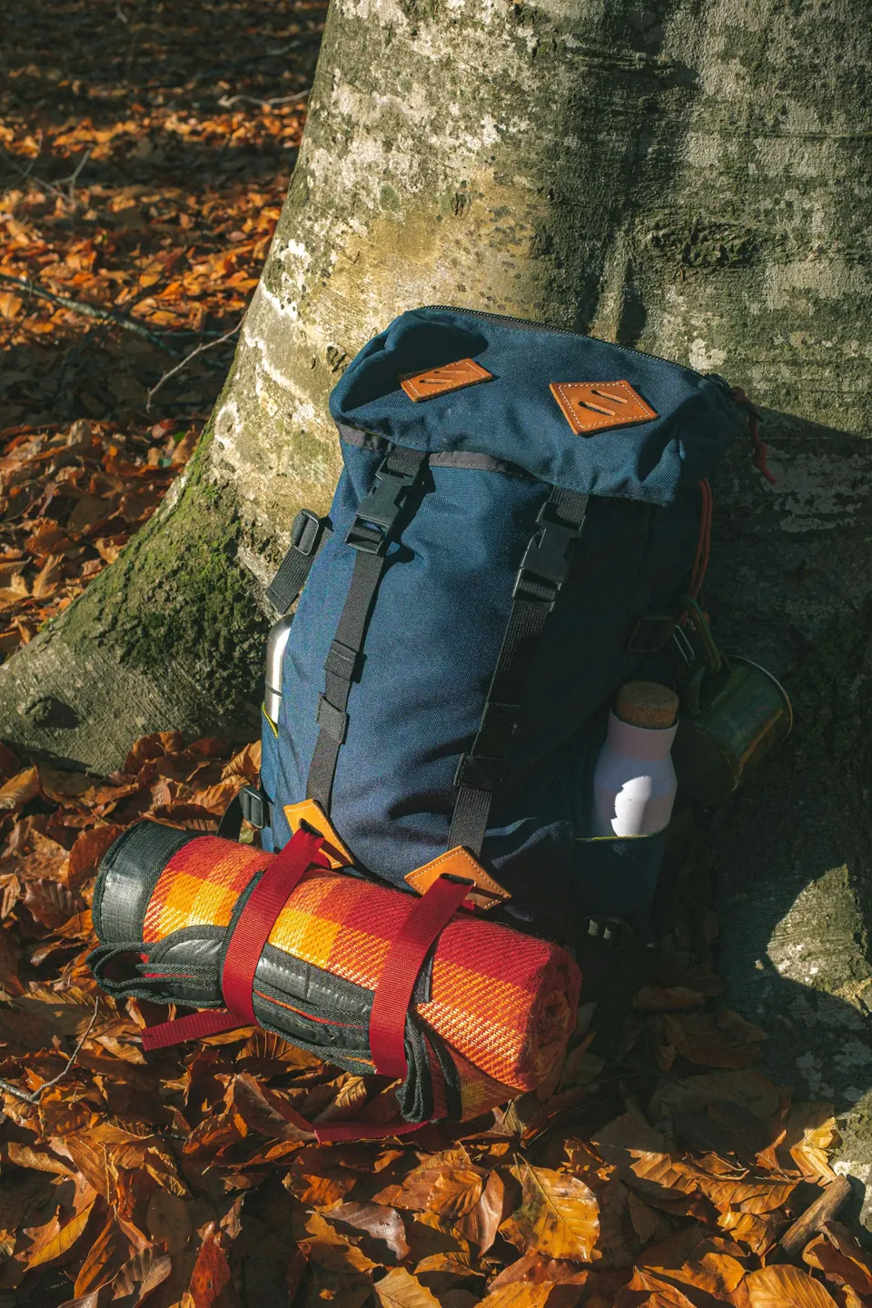 Trekking backpack with sleeping mat strapped on