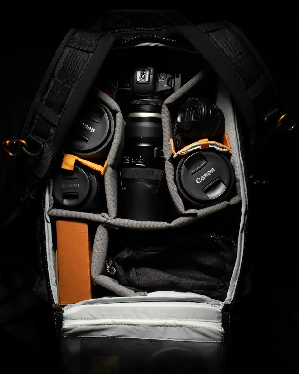 Black and orange backpack on white textile