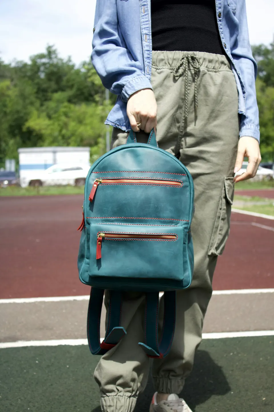 Man carrying blue backpack