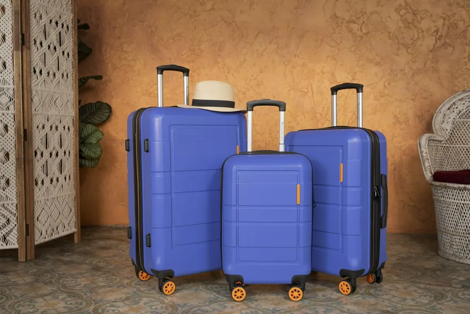 Three pieces of blue luggage