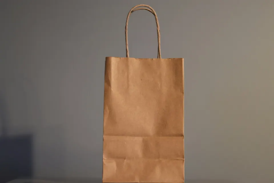 A brown paper bag on a table
