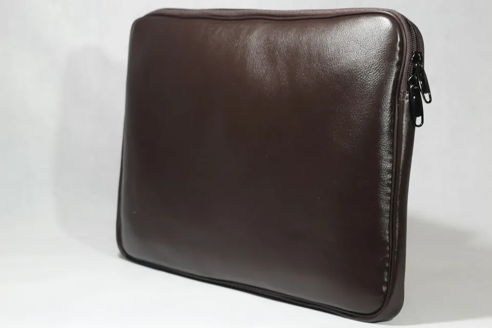A leather bag on a white surface