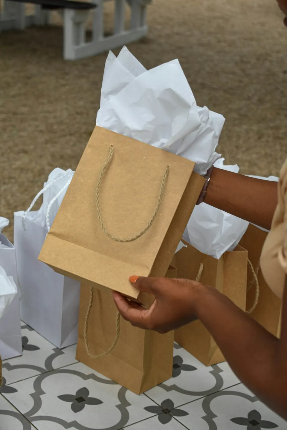 A woman holding a brown paper bag