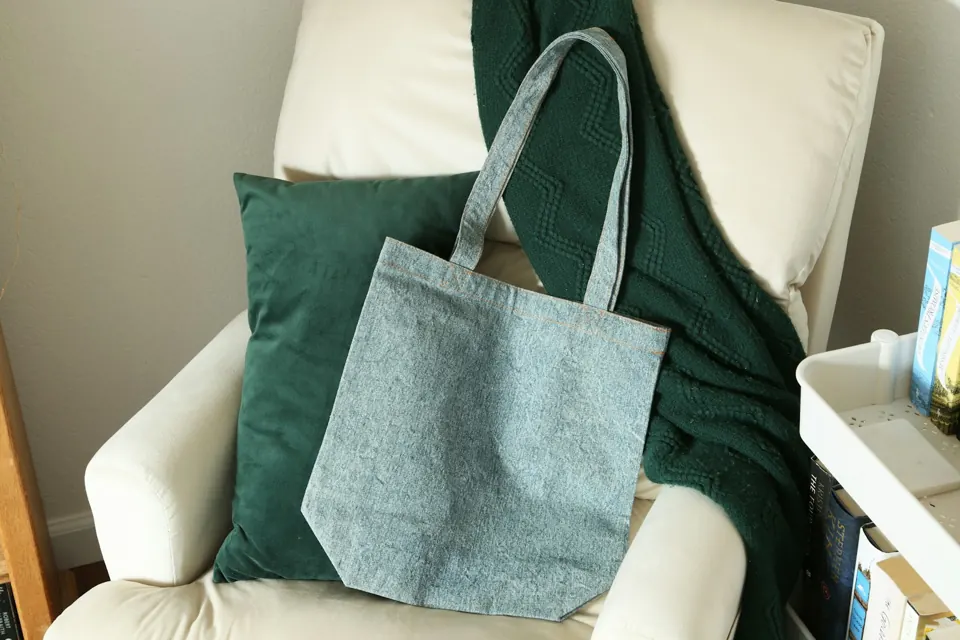 A blue bag on a white chair