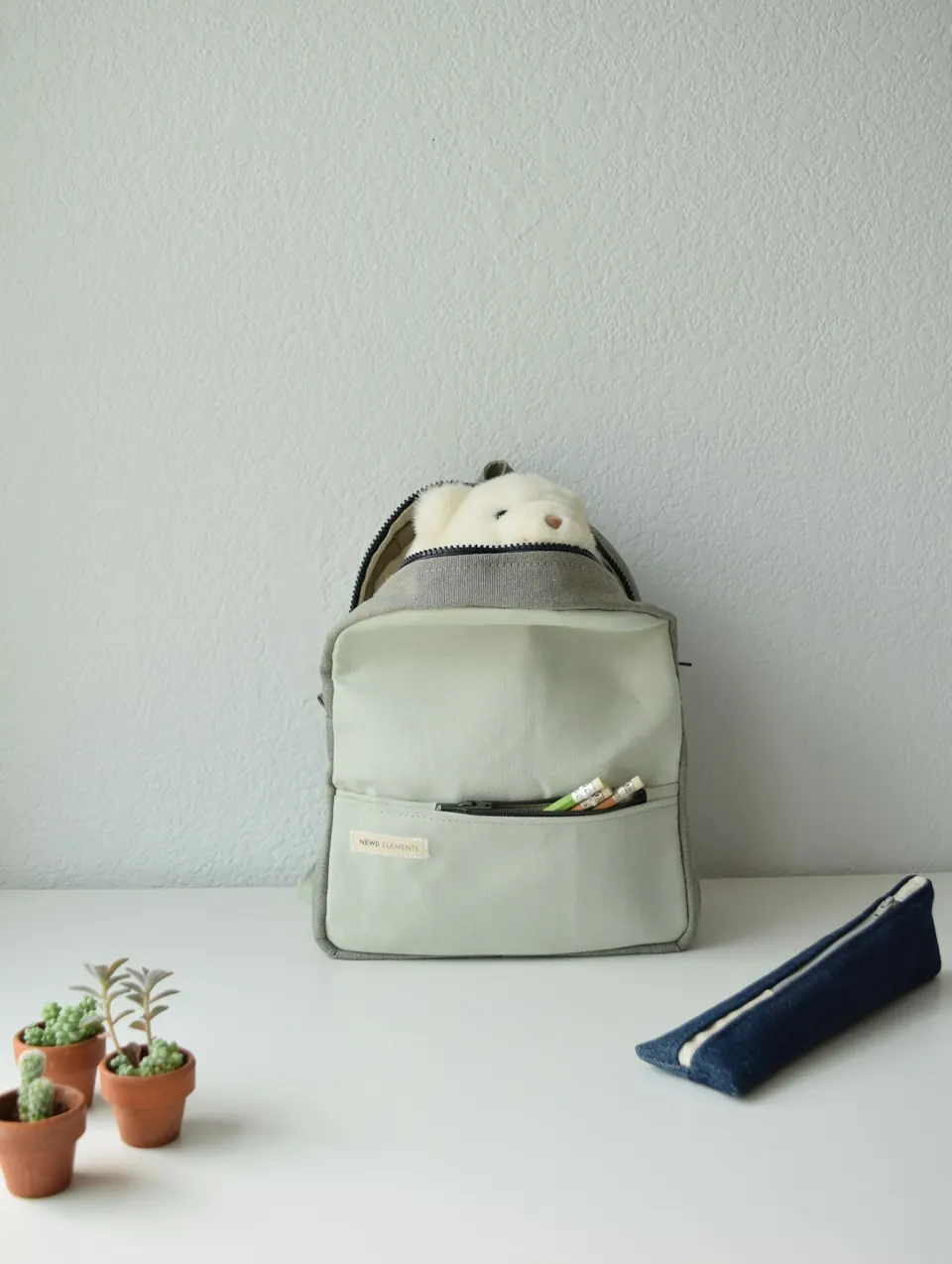 A backpack with supplies on a table