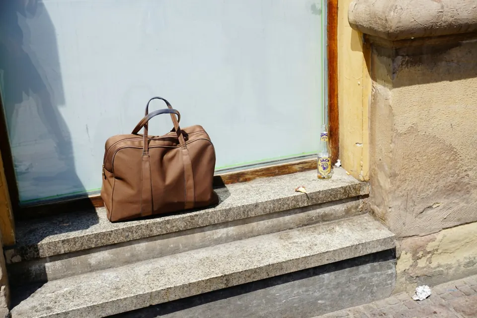 A brown bag sits on stone steps