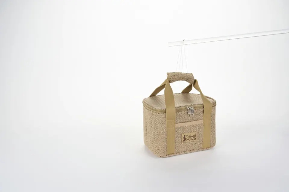 Tan woven cooler bag with beige handles